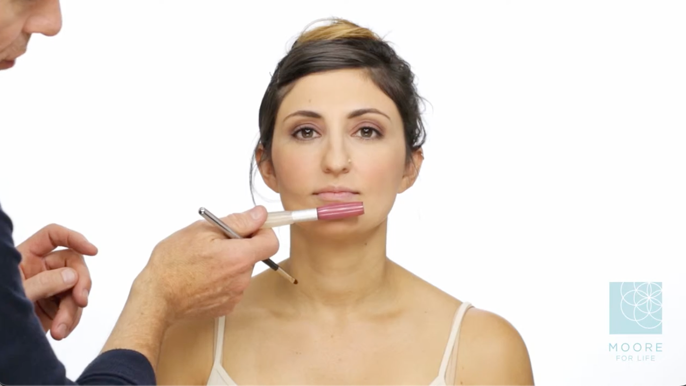 Bride to Be applying the right shade of lipstick